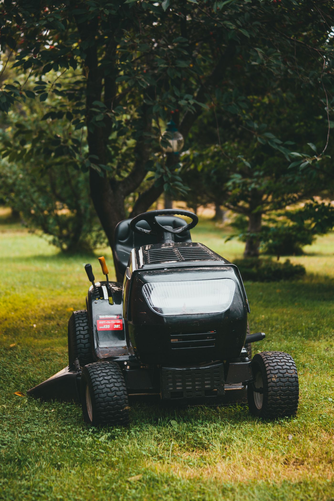 Freshly mowed lawn with commercial mower